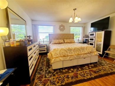 MUST SEE! Beautifully remodeled 2nd floor 2/2 condo in an active on Sunrise Lakes Phase IV Golf Course in Florida - for sale on GolfHomes.com, golf home, golf lot