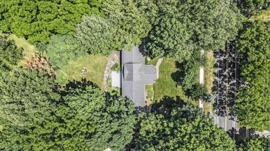 Introducing an exceptional Westwood home, perfectly poised on on Grand Prairie Golf Course in Michigan - for sale on GolfHomes.com, golf home, golf lot