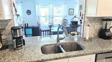 Welcome to this spotless, like new home that can be yours! on Mainlands Golf Club in Florida - for sale on GolfHomes.com, golf home, golf lot