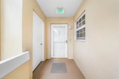Experience serene living in this inviting 3-bedroom end-unit on  in Florida - for sale on GolfHomes.com, golf home, golf lot