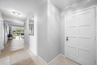 Experience serene living in this inviting 3-bedroom end-unit on  in Florida - for sale on GolfHomes.com, golf home, golf lot