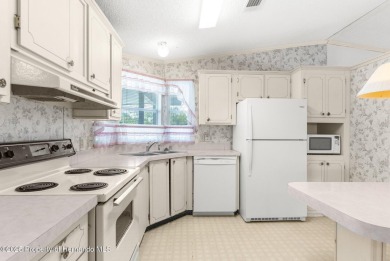 Welcome to this charming 2-BEDROOM, 2-BATHROOM, offering 1,178 on Brookridge Country Club in Florida - for sale on GolfHomes.com, golf home, golf lot