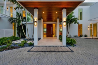 Experience the best of luxury living in this waterfront coastal on Sailfish Point Golf Club, Inc. in Florida - for sale on GolfHomes.com, golf home, golf lot