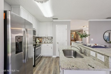 Enjoy low-maintenance living in this end unit two-story townhome on Golf Club At Fleming Island in Florida - for sale on GolfHomes.com, golf home, golf lot