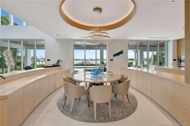 Experience the best of luxury living in this waterfront coastal on Sailfish Point Golf Club, Inc. in Florida - for sale on GolfHomes.com, golf home, golf lot
