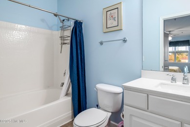 Experience coastal living at its finest in this meticulously on Crow Creek Golf Club in North Carolina - for sale on GolfHomes.com, golf home, golf lot