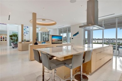 Experience the best of luxury living in this waterfront coastal on Sailfish Point Golf Club, Inc. in Florida - for sale on GolfHomes.com, golf home, golf lot