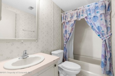 Welcome to this charming 2-BEDROOM, 2-BATHROOM, offering 1,178 on Brookridge Country Club in Florida - for sale on GolfHomes.com, golf home, golf lot