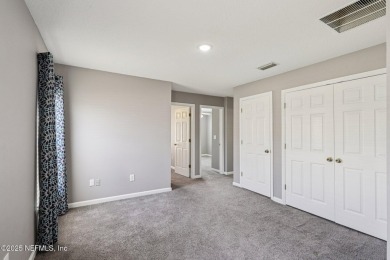 Enjoy low-maintenance living in this end unit two-story townhome on Golf Club At Fleming Island in Florida - for sale on GolfHomes.com, golf home, golf lot