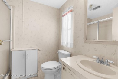 Welcome to this charming 2-BEDROOM, 2-BATHROOM, offering 1,178 on Brookridge Country Club in Florida - for sale on GolfHomes.com, golf home, golf lot
