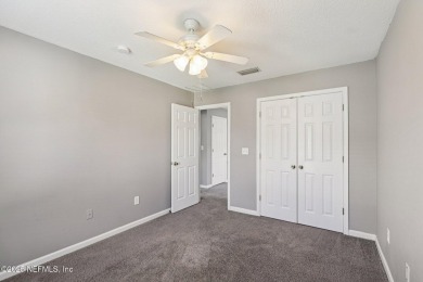 Enjoy low-maintenance living in this end unit two-story townhome on Golf Club At Fleming Island in Florida - for sale on GolfHomes.com, golf home, golf lot