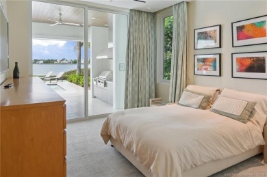 Experience the best of luxury living in this waterfront coastal on Sailfish Point Golf Club, Inc. in Florida - for sale on GolfHomes.com, golf home, golf lot