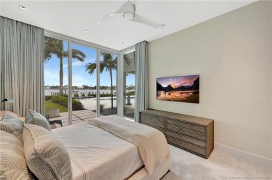 Experience the best of luxury living in this waterfront coastal on Sailfish Point Golf Club, Inc. in Florida - for sale on GolfHomes.com, golf home, golf lot