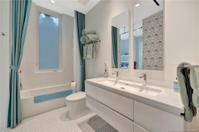 Experience the best of luxury living in this waterfront coastal on Sailfish Point Golf Club, Inc. in Florida - for sale on GolfHomes.com, golf home, golf lot