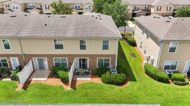 Enjoy low-maintenance living in this end unit two-story townhome on Golf Club At Fleming Island in Florida - for sale on GolfHomes.com, golf home, golf lot