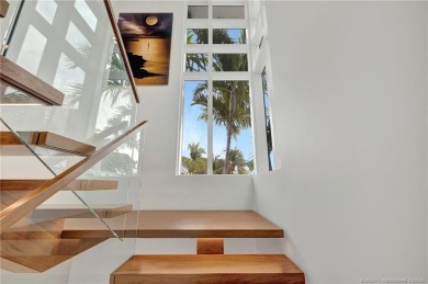 Experience the best of luxury living in this waterfront coastal on Sailfish Point Golf Club, Inc. in Florida - for sale on GolfHomes.com, golf home, golf lot