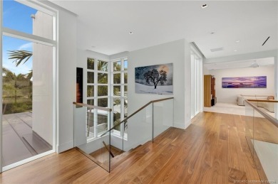 Experience the best of luxury living in this waterfront coastal on Sailfish Point Golf Club, Inc. in Florida - for sale on GolfHomes.com, golf home, golf lot