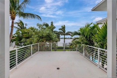 Experience the best of luxury living in this waterfront coastal on Sailfish Point Golf Club, Inc. in Florida - for sale on GolfHomes.com, golf home, golf lot