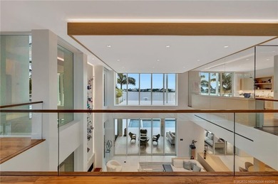 Experience the best of luxury living in this waterfront coastal on Sailfish Point Golf Club, Inc. in Florida - for sale on GolfHomes.com, golf home, golf lot