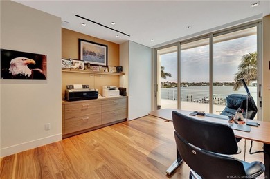 Experience the best of luxury living in this waterfront coastal on Sailfish Point Golf Club, Inc. in Florida - for sale on GolfHomes.com, golf home, golf lot