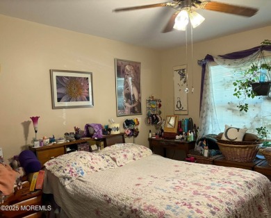 A Greenbriar model where access to the front door entrance is on Greenbriar Woodlands in New Jersey - for sale on GolfHomes.com, golf home, golf lot