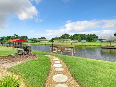 Under contract-accepting backup offers. WATERFRONT HOME on one on Indian Lake Estates Golf and Country Club in Florida - for sale on GolfHomes.com, golf home, golf lot