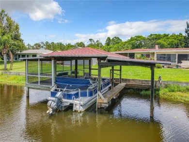 Under contract-accepting backup offers. WATERFRONT HOME on one on Indian Lake Estates Golf and Country Club in Florida - for sale on GolfHomes.com, golf home, golf lot