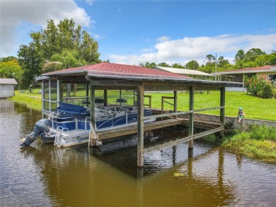 Under contract-accepting backup offers. WATERFRONT HOME on one on Indian Lake Estates Golf and Country Club in Florida - for sale on GolfHomes.com, golf home, golf lot