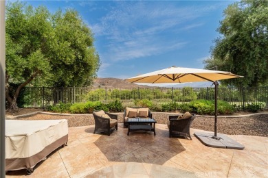 Welcome to effortless luxury in one of Corona's most exclusive on Glen Ivy Golf Club in California - for sale on GolfHomes.com, golf home, golf lot