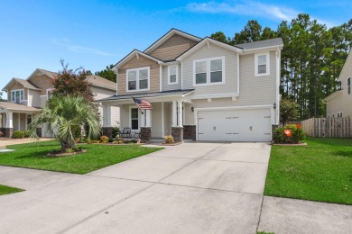 This stunning two-story home combines timeless Lowcountry charm on Cypress Point Par 3 in South Carolina - for sale on GolfHomes.com, golf home, golf lot