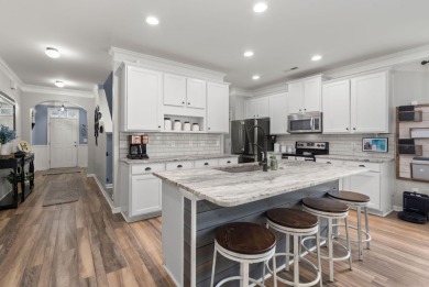 This stunning two-story home combines timeless Lowcountry charm on Cypress Point Par 3 in South Carolina - for sale on GolfHomes.com, golf home, golf lot