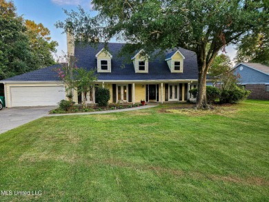 Take a look at this beautiful home located at the end of a on Diamondhead Country Club in Mississippi - for sale on GolfHomes.com, golf home, golf lot