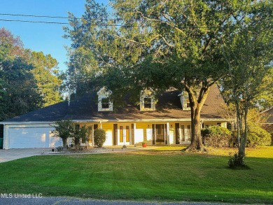 Take a look at this beautiful home located at the end of a on Diamondhead Country Club in Mississippi - for sale on GolfHomes.com, golf home, golf lot