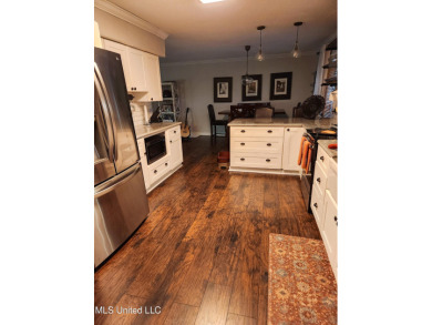 Take a look at this beautiful home located at the end of a on Diamondhead Country Club in Mississippi - for sale on GolfHomes.com, golf home, golf lot
