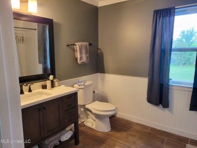 Take a look at this beautiful home located at the end of a on Diamondhead Country Club in Mississippi - for sale on GolfHomes.com, golf home, golf lot