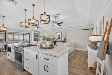 This beautifully renovated corner unit Villa has it all! on The Golf Club of Jupiter in Florida - for sale on GolfHomes.com, golf home, golf lot