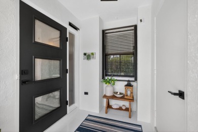 This beautifully renovated corner unit Villa has it all! on The Golf Club of Jupiter in Florida - for sale on GolfHomes.com, golf home, golf lot