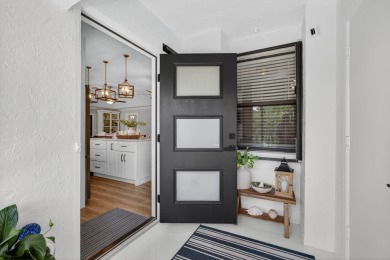 This beautifully renovated corner unit Villa has it all! on The Golf Club of Jupiter in Florida - for sale on GolfHomes.com, golf home, golf lot