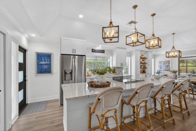 This beautifully renovated corner unit Villa has it all! on The Golf Club of Jupiter in Florida - for sale on GolfHomes.com, golf home, golf lot