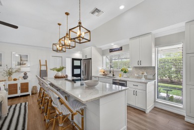 This beautifully renovated corner unit Villa has it all! on The Golf Club of Jupiter in Florida - for sale on GolfHomes.com, golf home, golf lot