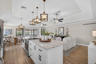 This beautifully renovated corner unit Villa has it all! on The Golf Club of Jupiter in Florida - for sale on GolfHomes.com, golf home, golf lot