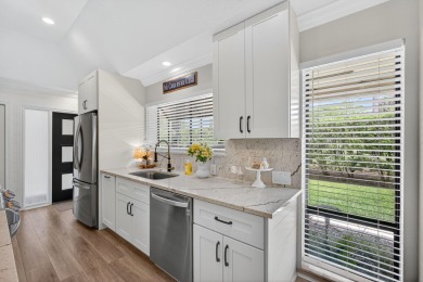 This beautifully renovated corner unit Villa has it all! on The Golf Club of Jupiter in Florida - for sale on GolfHomes.com, golf home, golf lot