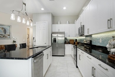 Beautifully appointed 2/2/2 home with a large den that can on Meadowood Golf and Tennis Club in Florida - for sale on GolfHomes.com, golf home, golf lot