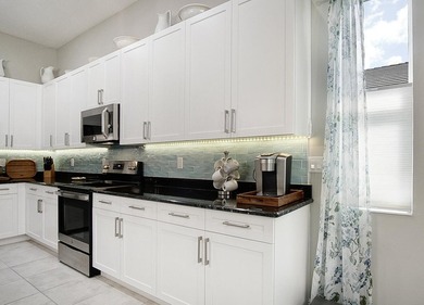 Beautifully appointed 2/2/2 home with a large den that can on Meadowood Golf and Tennis Club in Florida - for sale on GolfHomes.com, golf home, golf lot