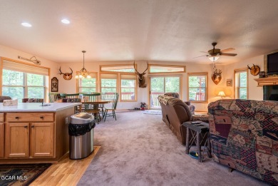 This turnkey furnished 3bd/2bath Ranch sits on a full third acre on Grand Lake Golf Course in Colorado - for sale on GolfHomes.com, golf home, golf lot