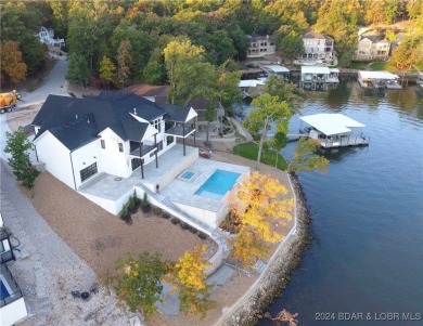 Welcome to this new construction home in Porto Cima @ Lake of on The Club At Porto Cima in Missouri - for sale on GolfHomes.com, golf home, golf lot