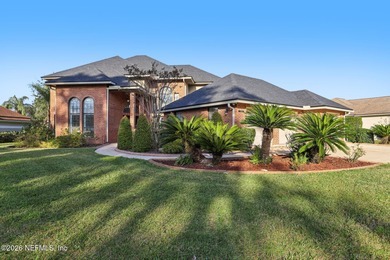 All brick two-story Eagle Harbor home with pond and fairway on Eagle Harbor Golf Club in Florida - for sale on GolfHomes.com, golf home, golf lot