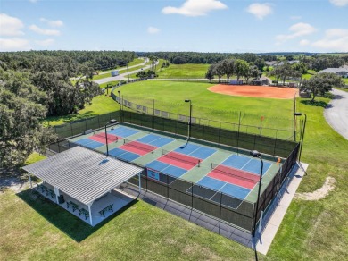 Welcome to this expanded Duke model in the highly desirable 55+ on Monarch At Royal Highlands in Florida - for sale on GolfHomes.com, golf home, golf lot