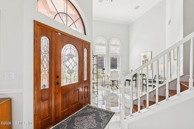 All brick two-story Eagle Harbor home with pond and fairway on Eagle Harbor Golf Club in Florida - for sale on GolfHomes.com, golf home, golf lot