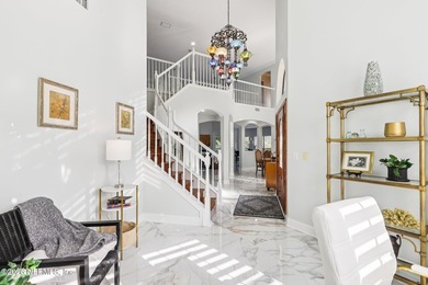 All brick two-story Eagle Harbor home with pond and fairway on Eagle Harbor Golf Club in Florida - for sale on GolfHomes.com, golf home, golf lot